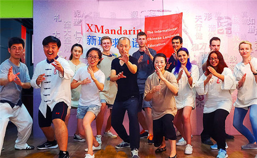 Xmandarin students and teachers doing a classic defensive pose, they learned Kungfu at a special cultural learning event