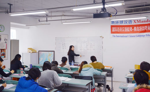 Group of XMandarin students holding their Chinese calligraphy (一生平安 “long and peaceful life”) art during an extra-curricular event